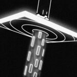 a black and white photo of a street light